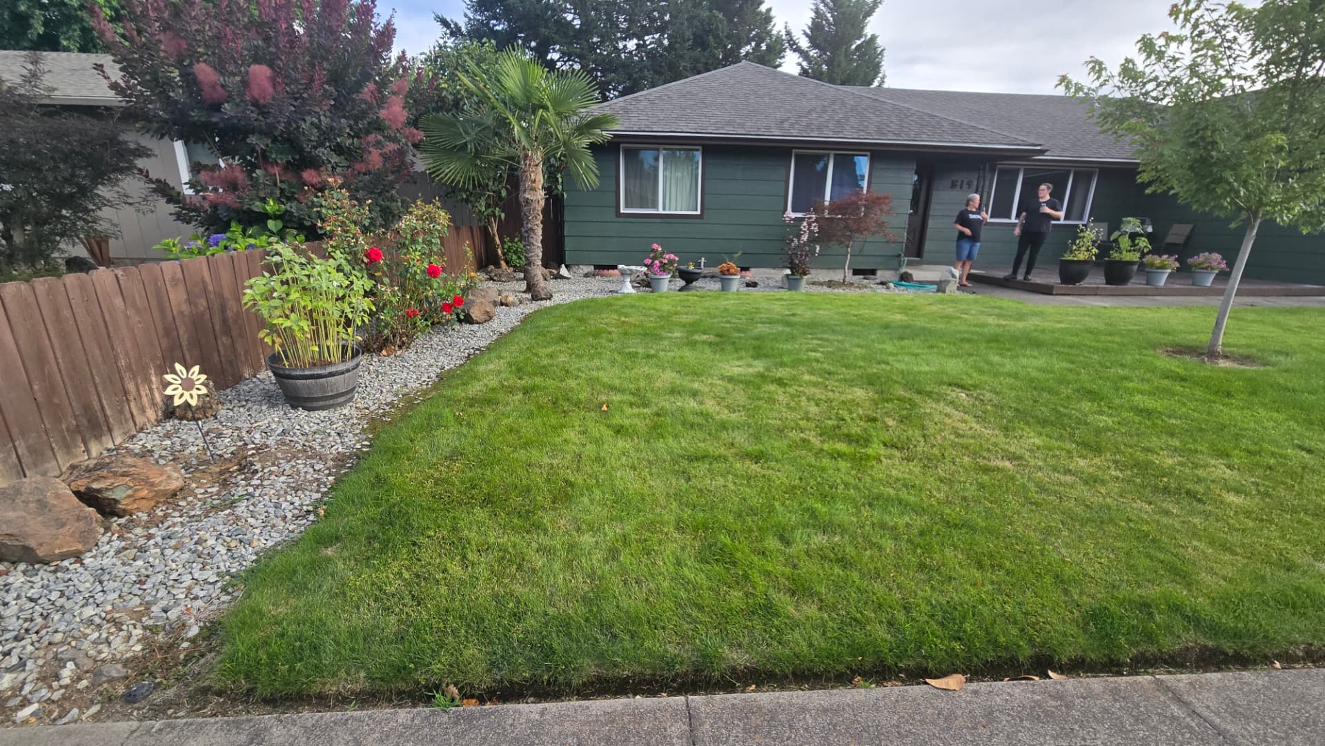 Front yard bed with no edging before decorative curbing
